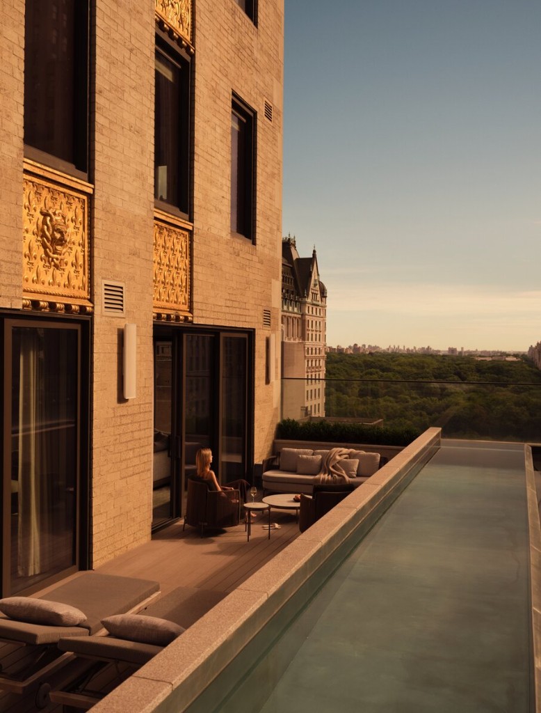 A private terrace and pool at a home at Aman New York, looking over the park